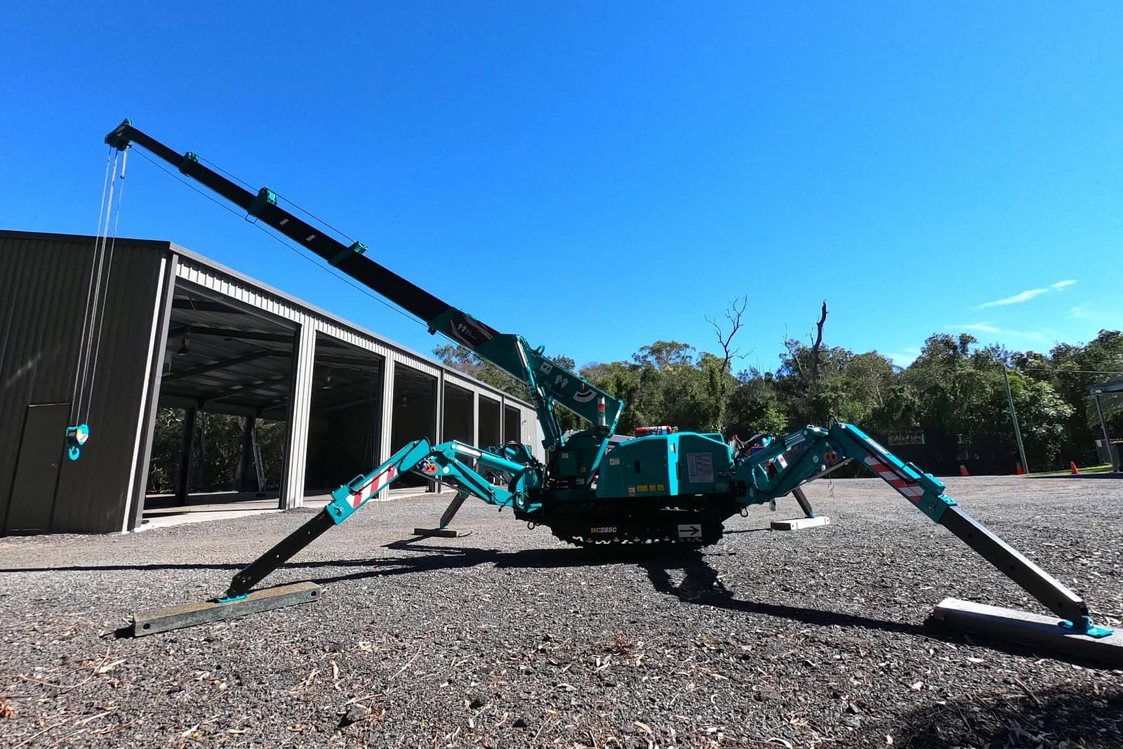 A Maeda mini crawler crane set up on its outriggers